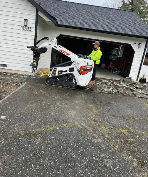 Broom Finish Driveway Replacement With Decorative Borders in Newcastle 